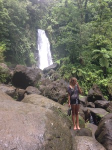 Niamh scaling the waterfall rocks, Dominica.